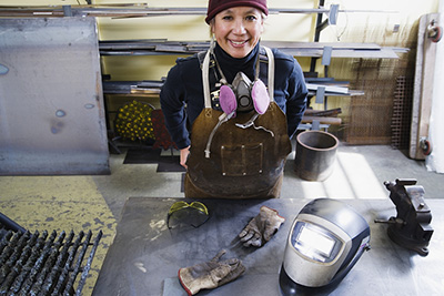 woman with welding gear