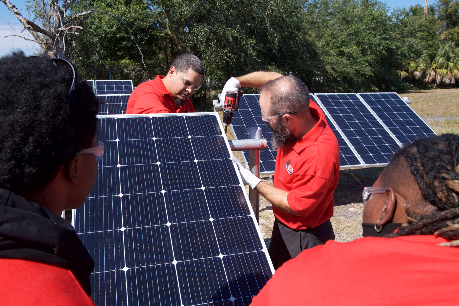 TWS students working in solar panel field