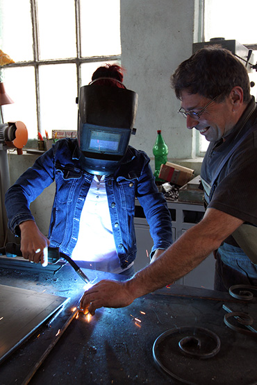 female learning how to weld