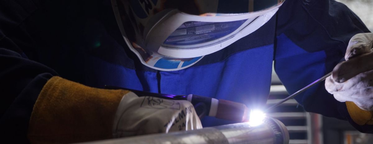 female welder working at local company