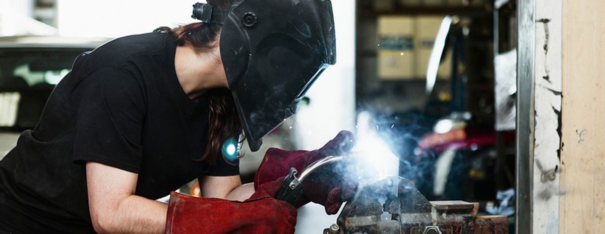 female welder working in shop