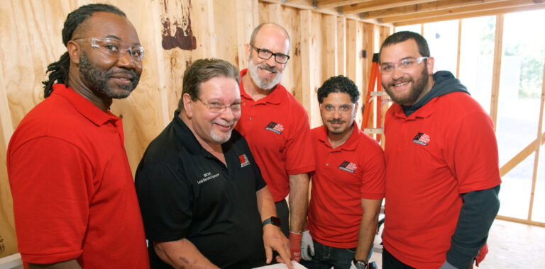 Electrical students and an instructor practice construction skills