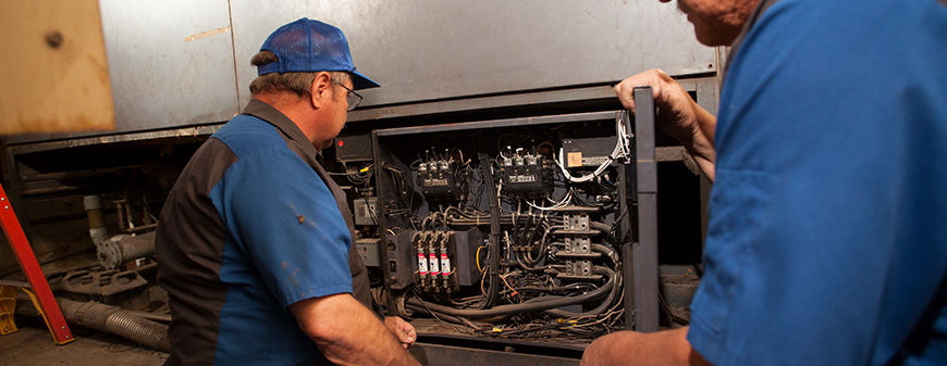 hvac technician maintaining ac
