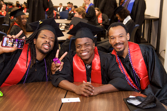 TWS students at graduation smiling