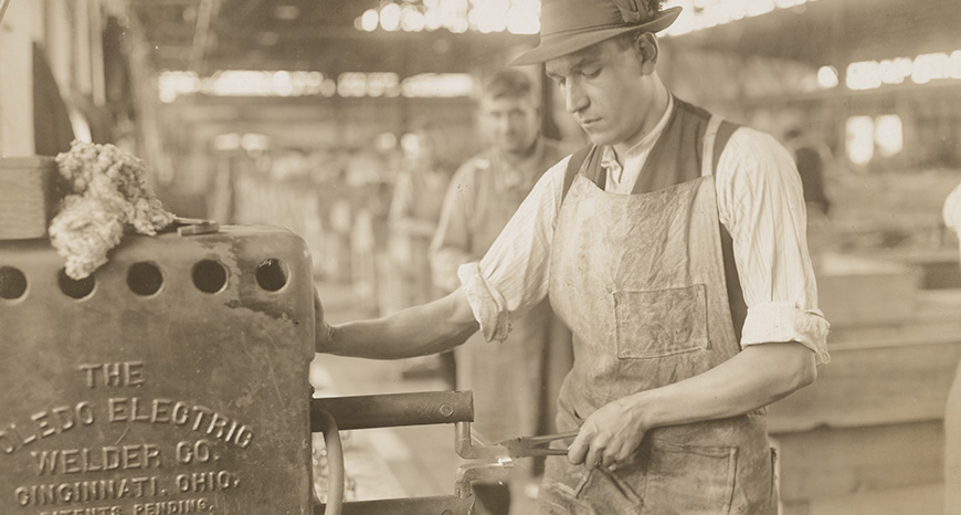 man using electric welding machine