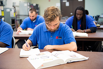 student studying in hvac class