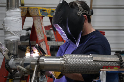 young welding student
